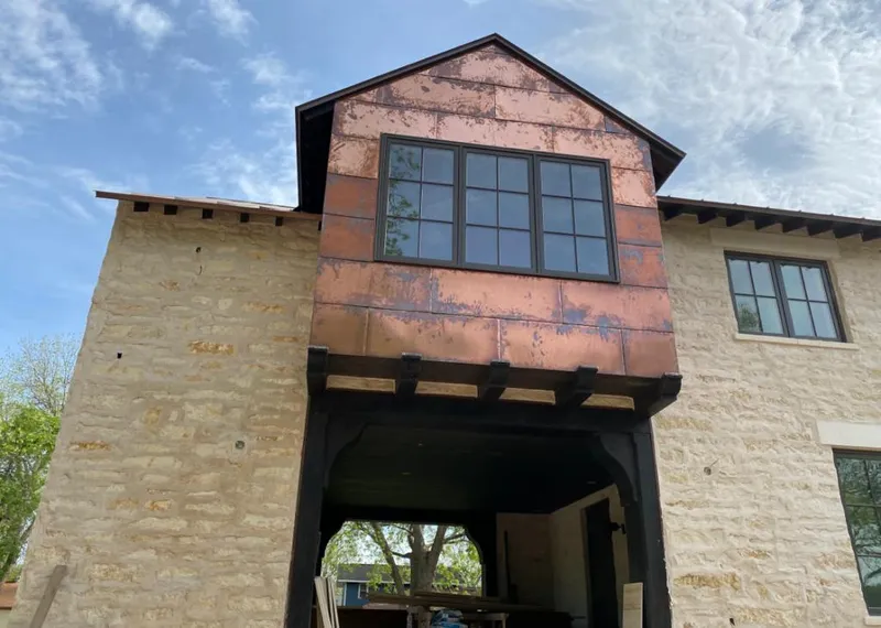 Copper metal panel facade on a stone building for Roof Repair in North Codorus